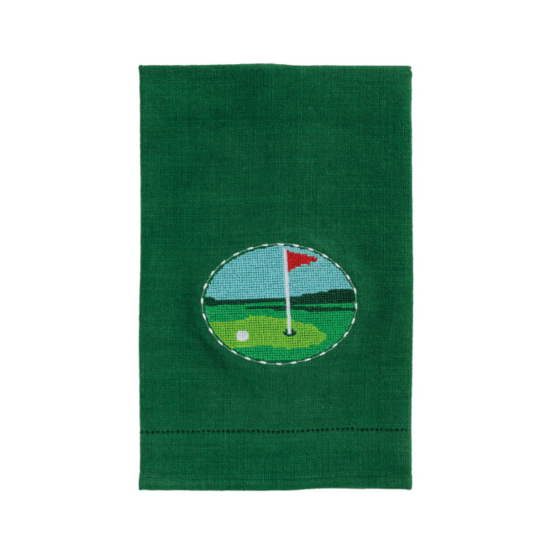 Green towel with a golf-themed patch on a white background
