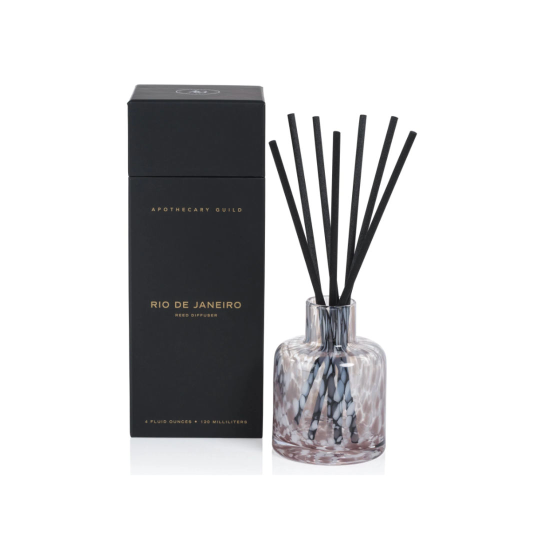 Aromatherapy diffuser with black sticks and a black box labeled 'Rio de Janeiro' on a white background.