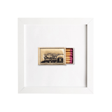 Matchbox with pink matches inside a white frame