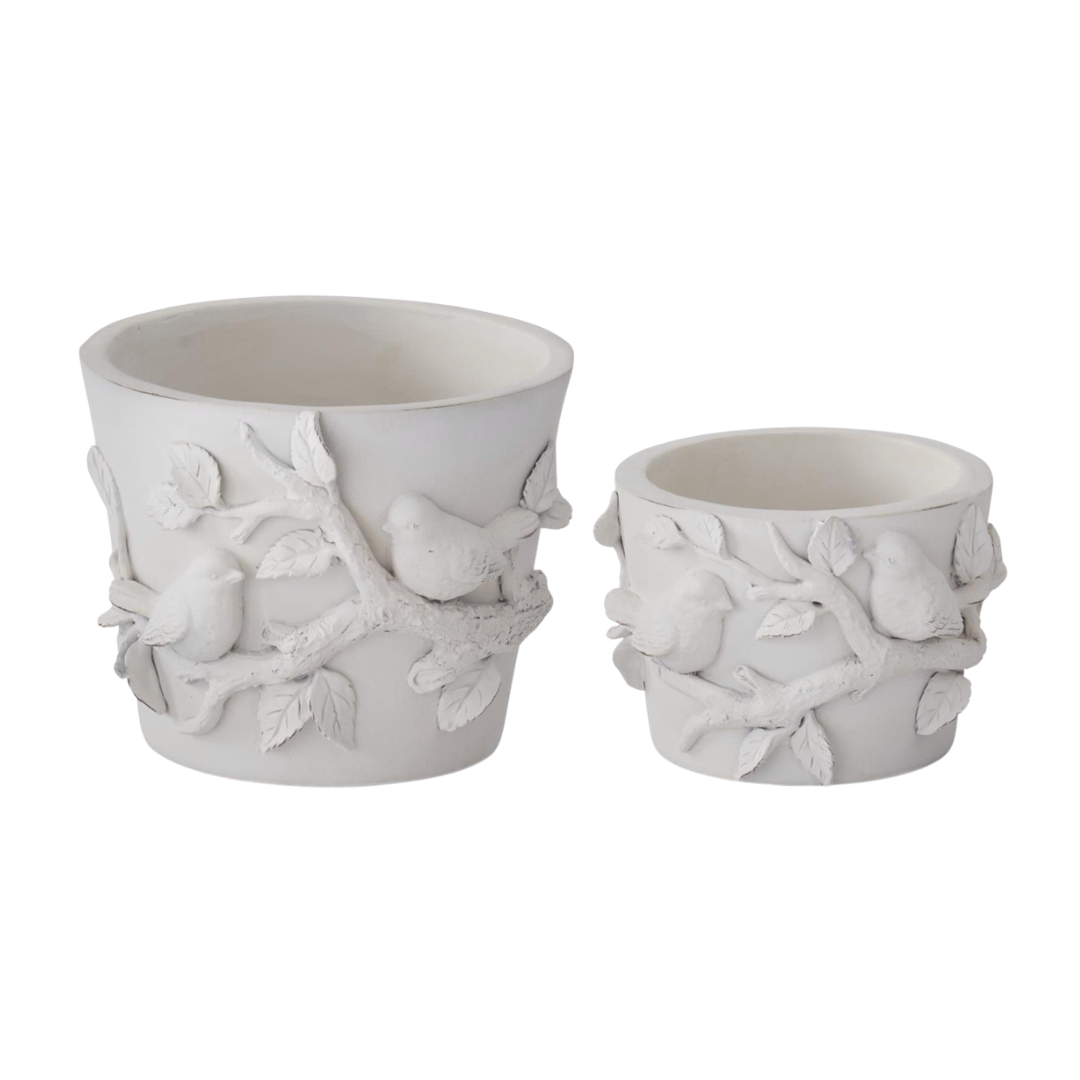 Two white ceramic planters with bird and branch design on a white background