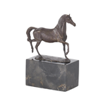 Bronze horse sculpture on a marble base against a white background