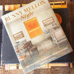 Book titled 'Bunny Mellon Style' on a wooden surface