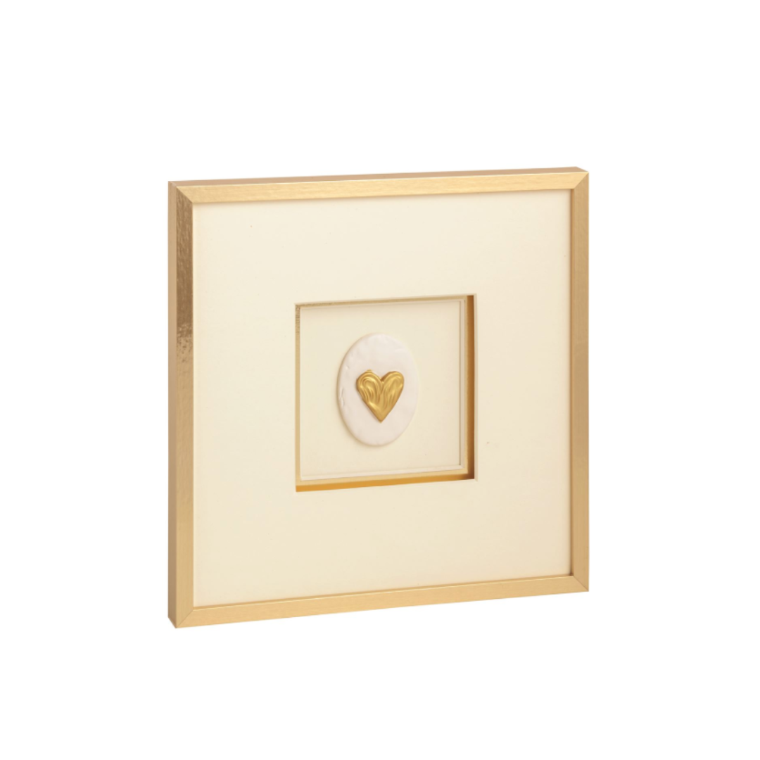 Framed artwork with a gold heart design on a white background