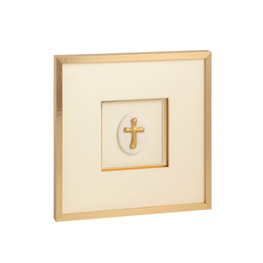 Framed artwork with a gold cross on a white background
