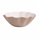 Beige enamel bowl with wavy edge on a white background