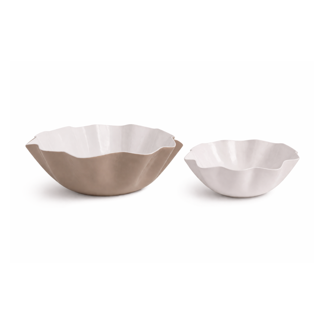 Two enamel bowls, one beige and one white, on a white background