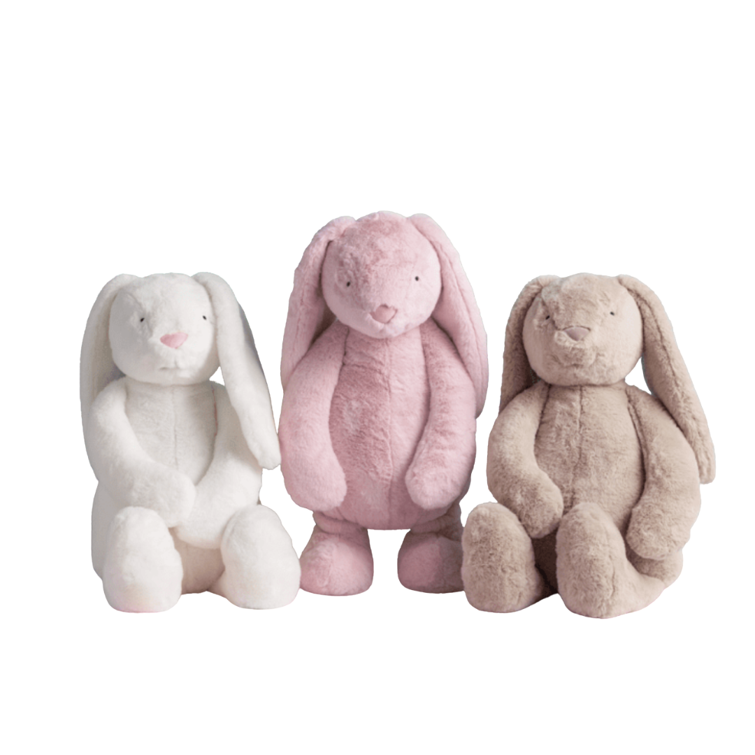 Three plush bunny toys in white, pink, and beige on a white background