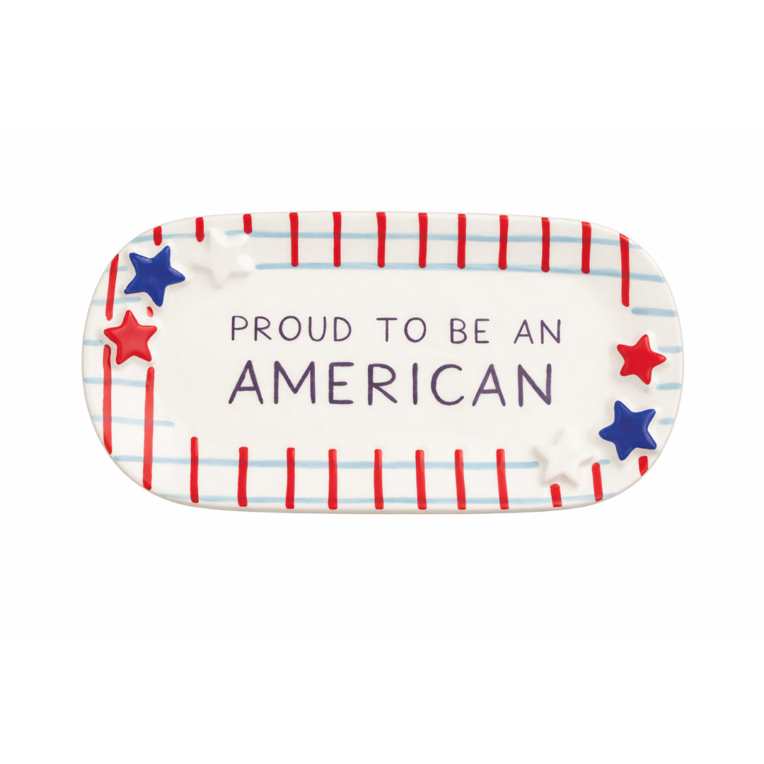 Decorative plate with 'Proud to be an American' text and stars on a white background