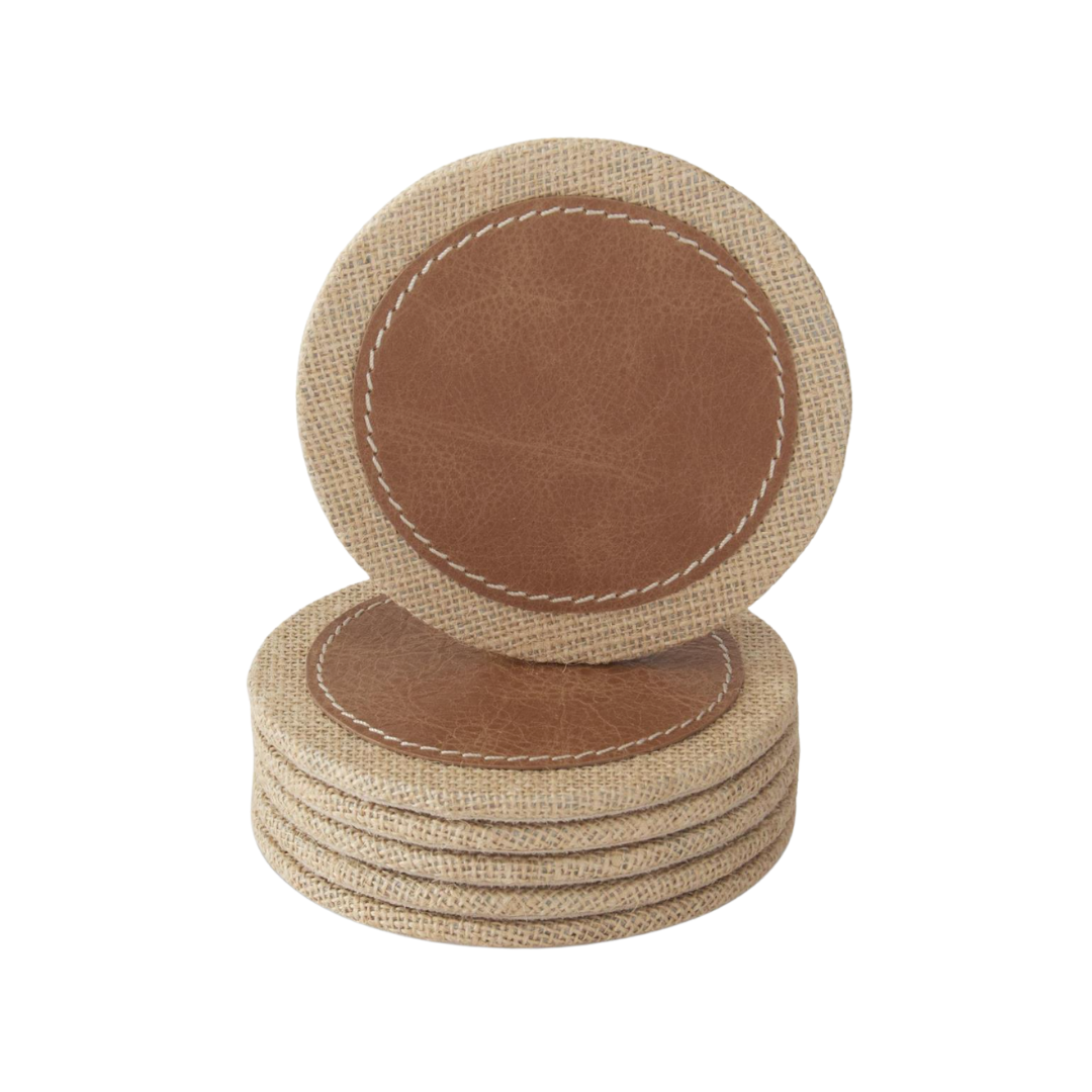 Set of round brown coasters with beige fabric backing on a white background