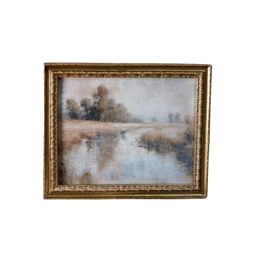 Framed painting of a landscape with trees and water on a white background