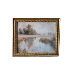 Framed painting of a landscape with trees and water on a white background