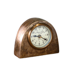 Decorative clock with a brown arched casing on a white background