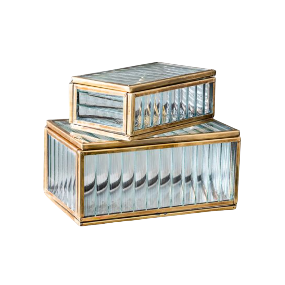Set of two decorative boxes with gold accents and clear glass panels on a white background