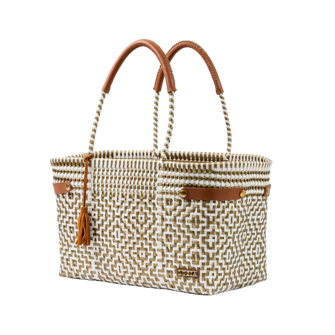 Woven handbag with brown handles and accents on a white background