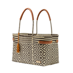 Woven handbag with geometric pattern and brown handles on a white background
