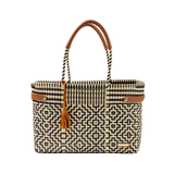 Woven handbag with geometric pattern and brown handle on a white background