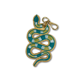 A snake-shaped embroidered keychain charm with a gold border, featuring green, yellow, and white stripes, complete with a gold lobster clasp at the top, shown on a plain white background.