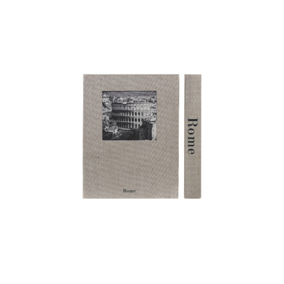 A storage box designed to look like a book featuring a black-and-white illustration of the Rome skyline, shown alongside a narrow matching strip with the text 'Rome' printed vertically.
