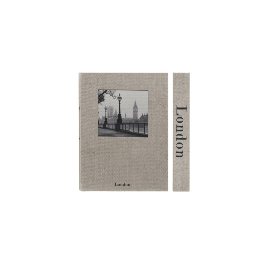 A storage box designed to look like a book featuring a black-and-white illustration of the London skyline, shown alongside a narrow matching strip with the text 'London' printed vertically.