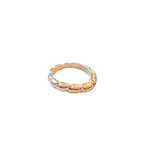 Gold ring with a braided design on a white background