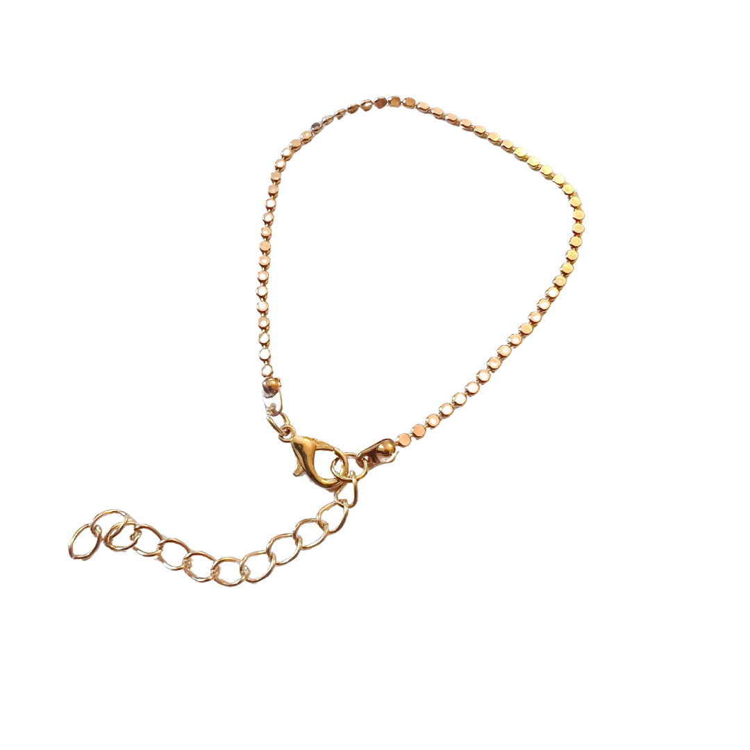 Gold bracelet on a white background