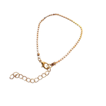 Gold bracelet on a white background