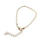 Gold bracelet on a white background