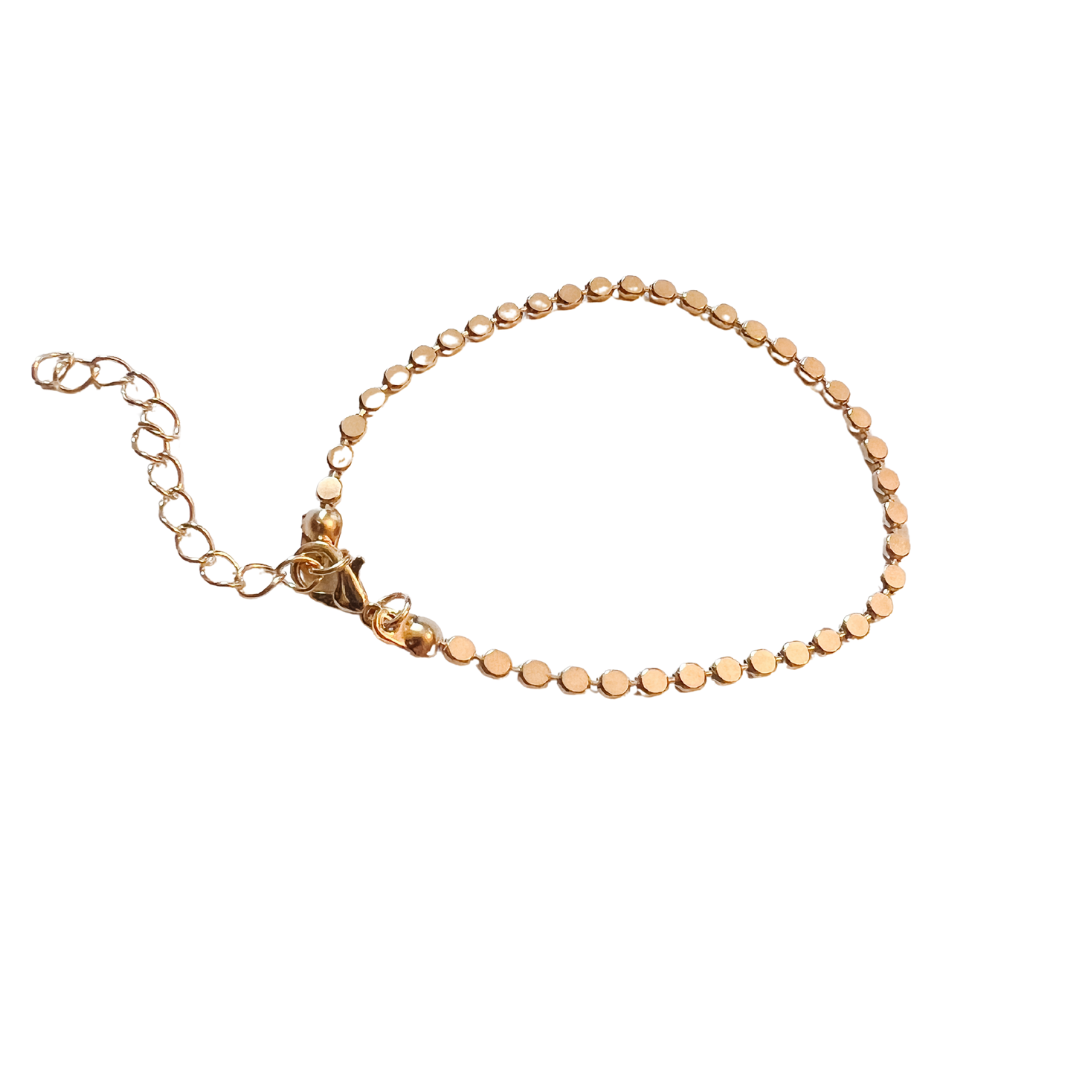 Gold bracelet on a white background