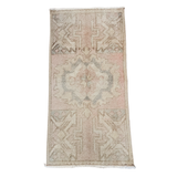 Textured area rug with geometric pattern on a white background