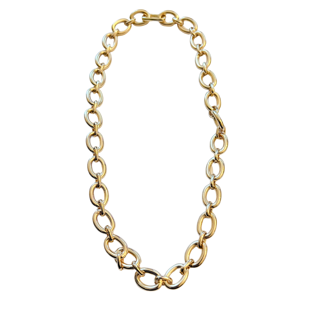 Alma necklace with 18-inch gold chain and .75-inch push clasp, shown worn alone and styled with decorative charms