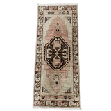Decorative rug with intricate patterns on a white background