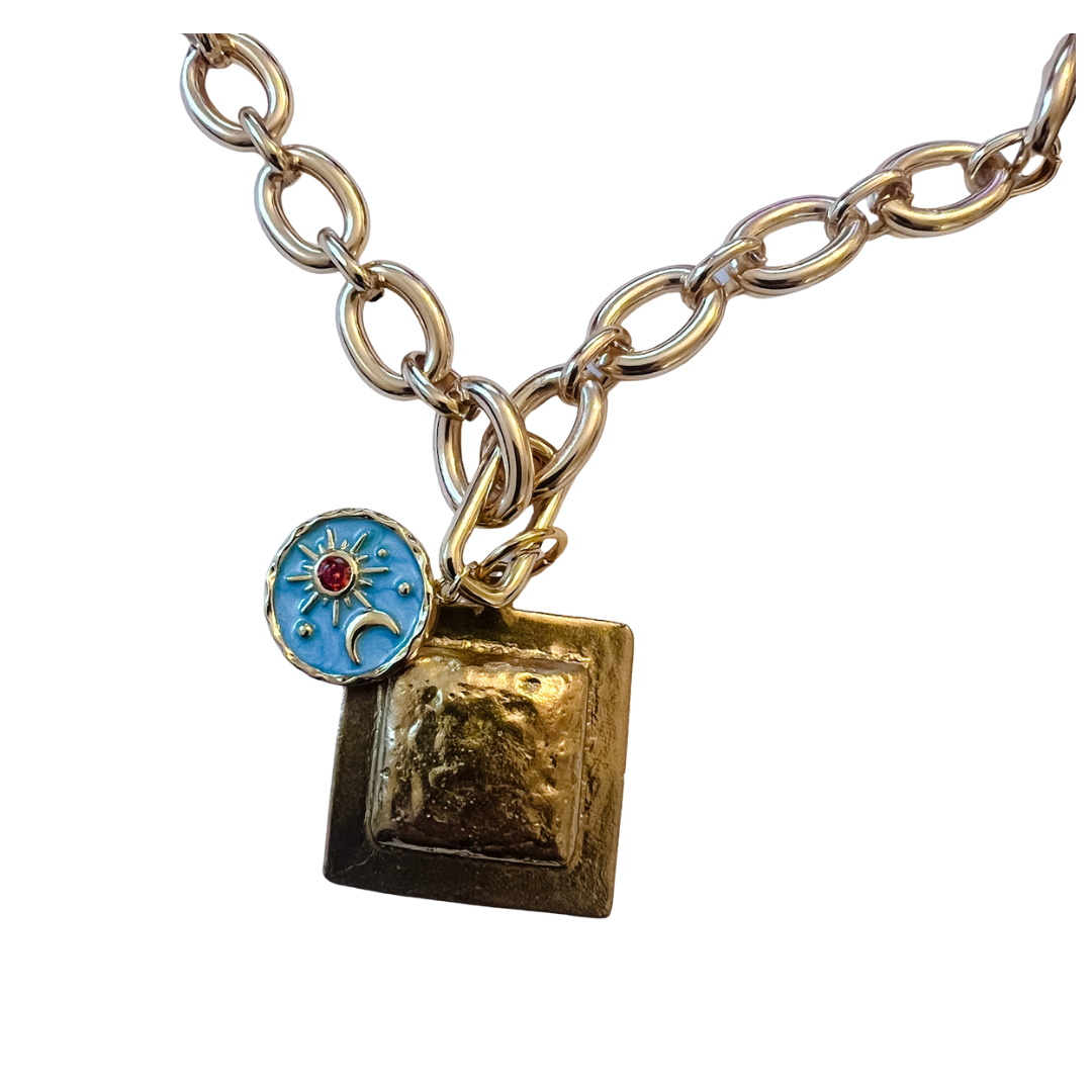 Alma necklace with 18-inch gold chain and .75-inch push clasp, shown worn alone and styled with decorative charms