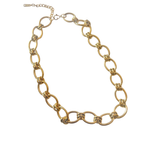 Gold chain necklace on a white background