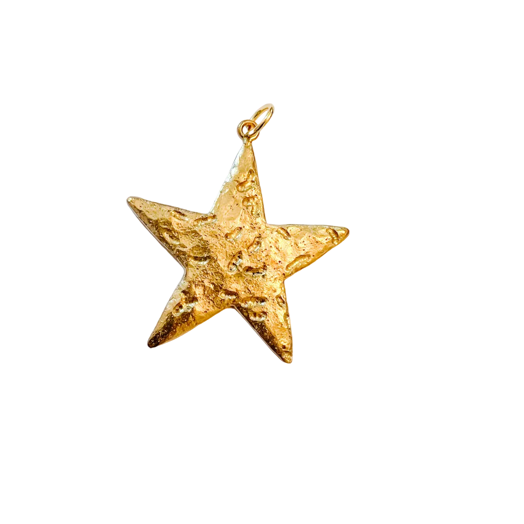 Gold textured star charm with a hammered finish, measuring 1.75 x 1.75 inches, photographed on a white background.