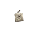 Two-sided silver square charm featuring the number 41 on one side and a heart with a cross design on the reverse, photographed on a neutral background.
