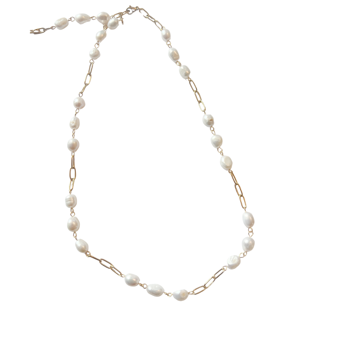 Freshwater pearl necklace with irregular white pearls and gold paperclip chain links, styled on a white background.