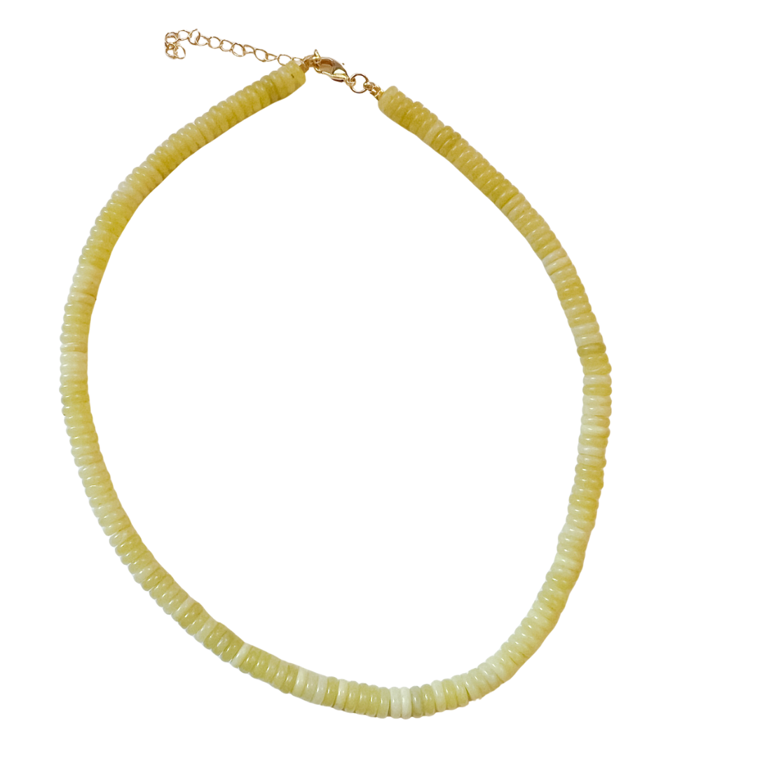 Necklace with lime  beads on a white background