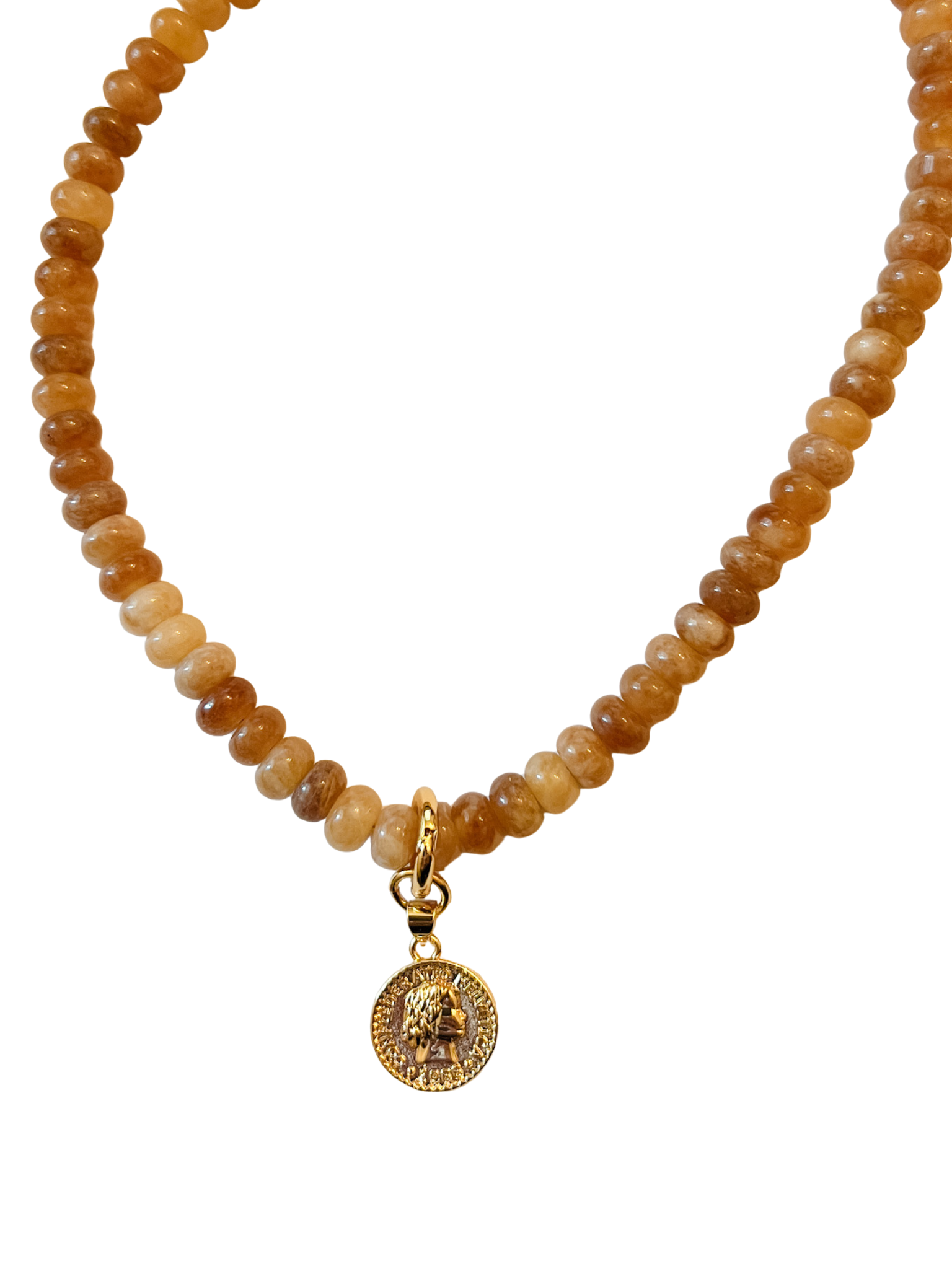 Necklace with brown beads and a gold pendant on a white background