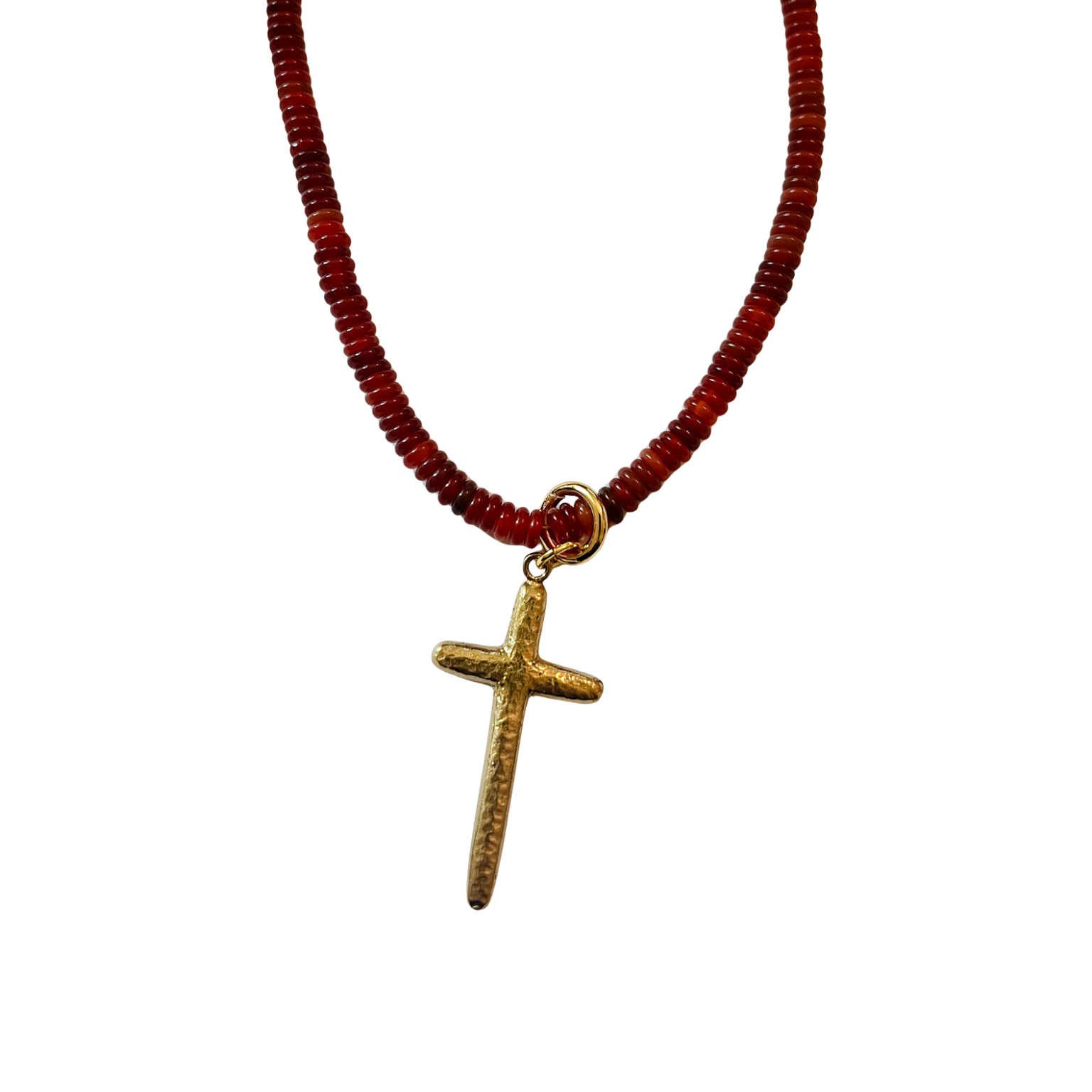 Deep rust and burgundy faceted disc bead necklace with gold clasp and extender, shown styled with a gold cross charm on a white background.