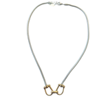 Silver snake chain necklace featuring a gold equestrian horse-bit centerpiece with mixed metal detailing on a white background.