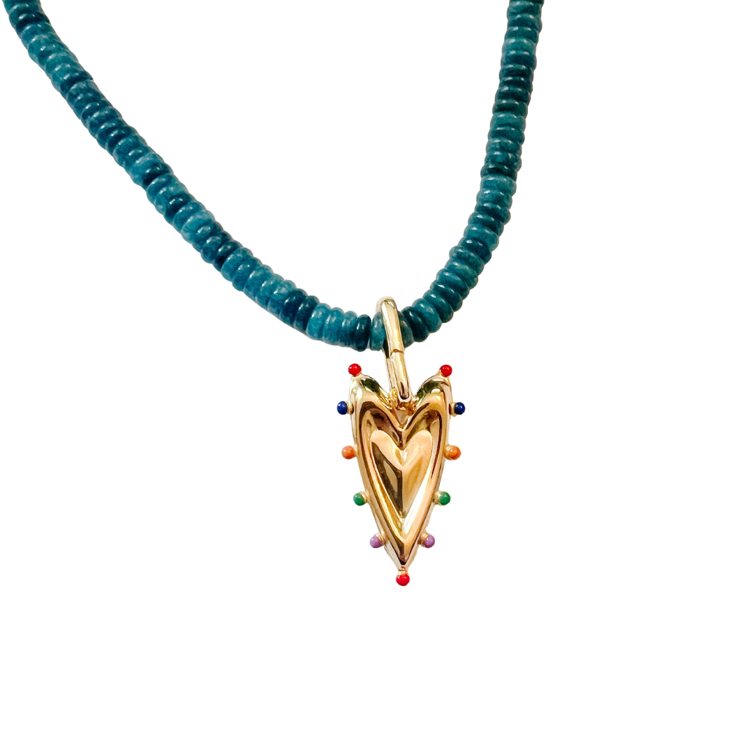 Necklace with blue beads and a gold heart-shaped pendant on a white background