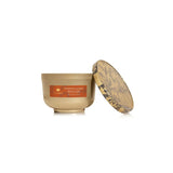 Beige candle with a decorative lid on a white background