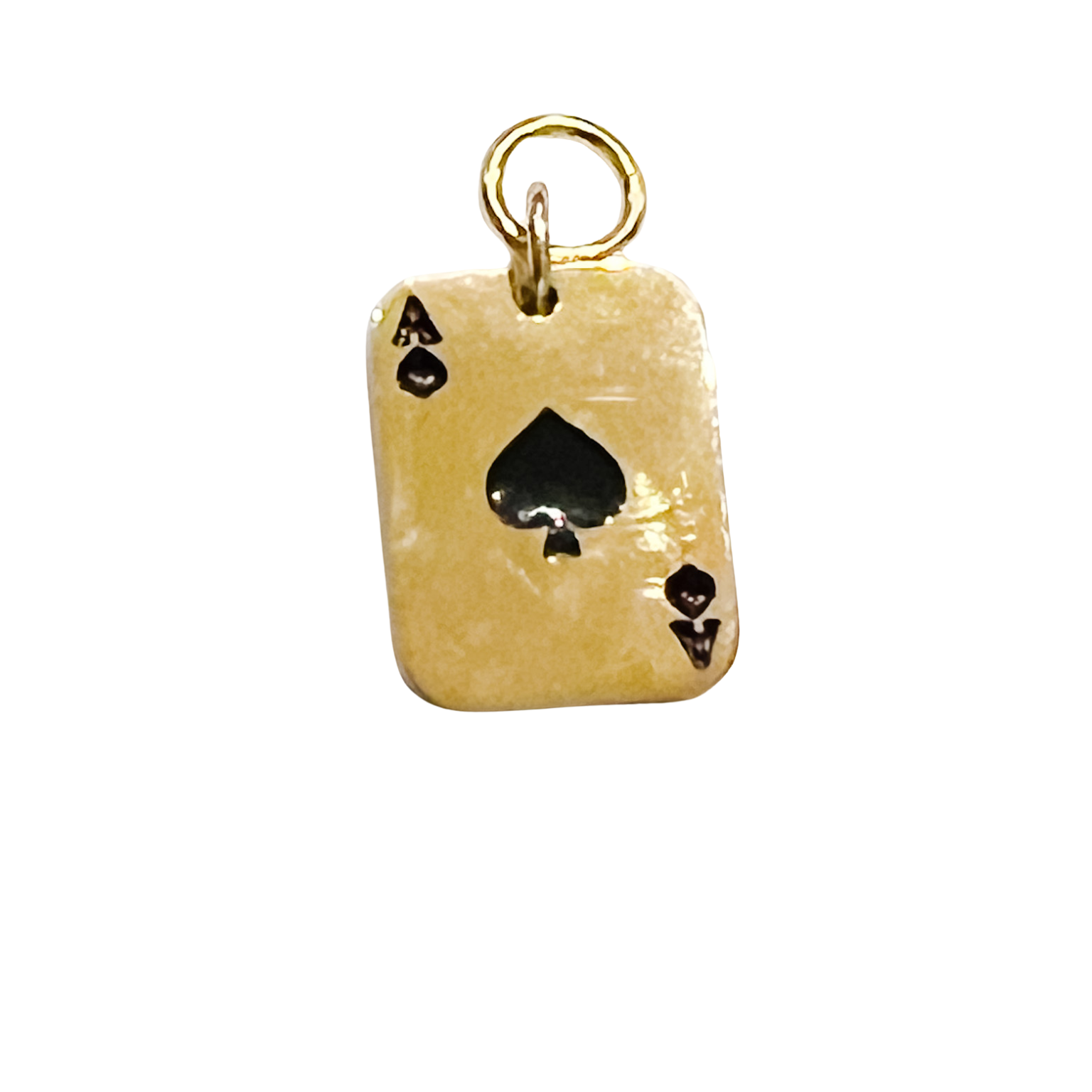 Gold rectangular charm with black spade symbol and playing card details on a white background.