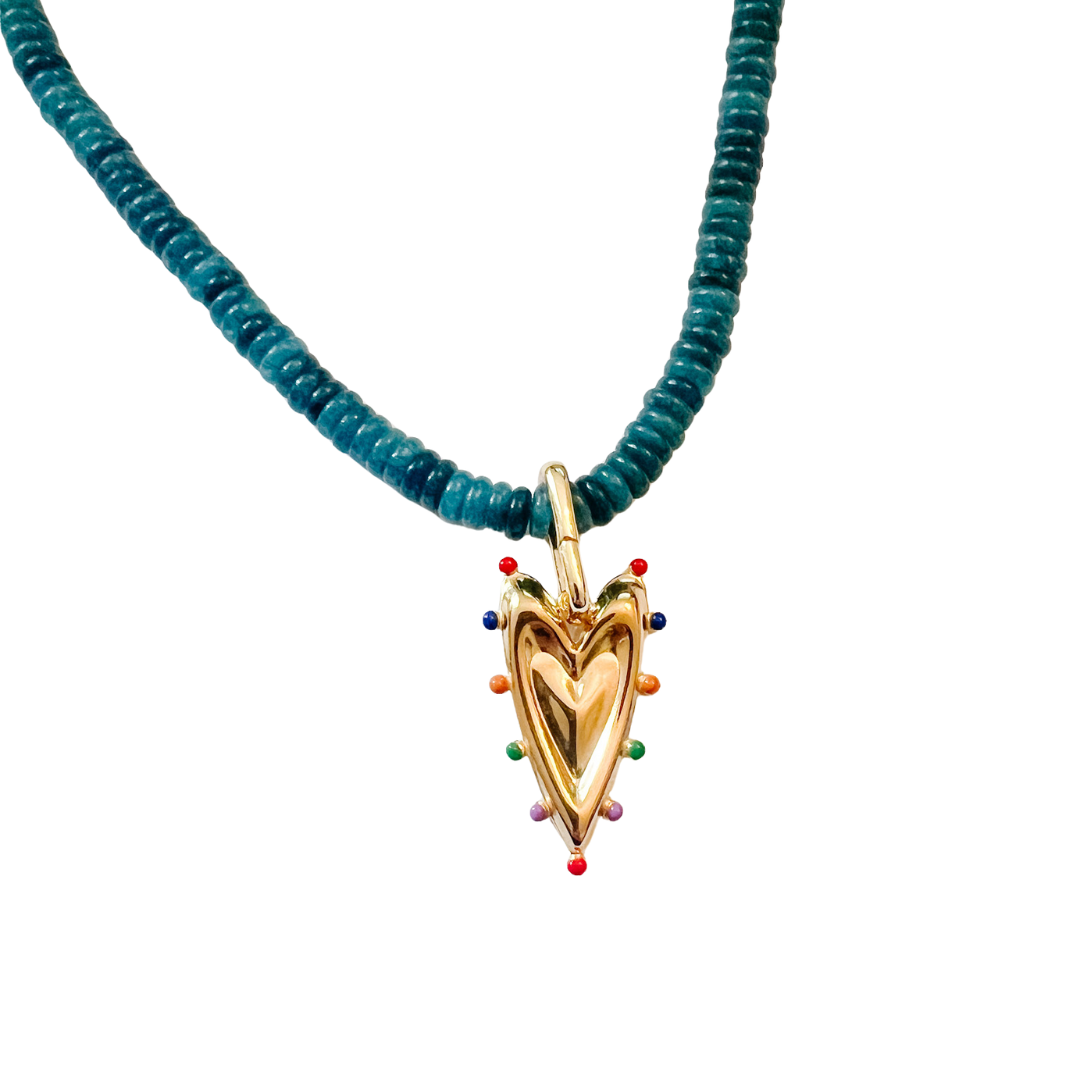 Gold heart charm with colorful bead accents hanging from a teal beaded necklace on a white background.