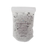 Bath bomb with speckles on a white background