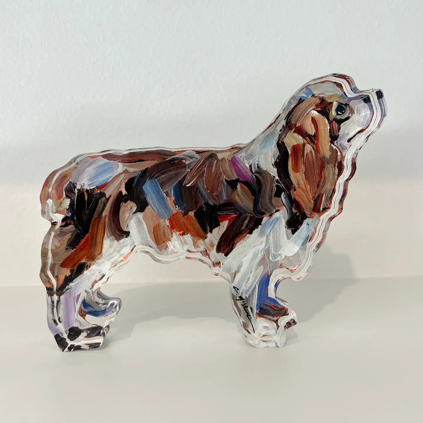 Acrylic Cavalier King Charles dog shelfie featuring painted artwork encased in a thick clear freestanding block on white background