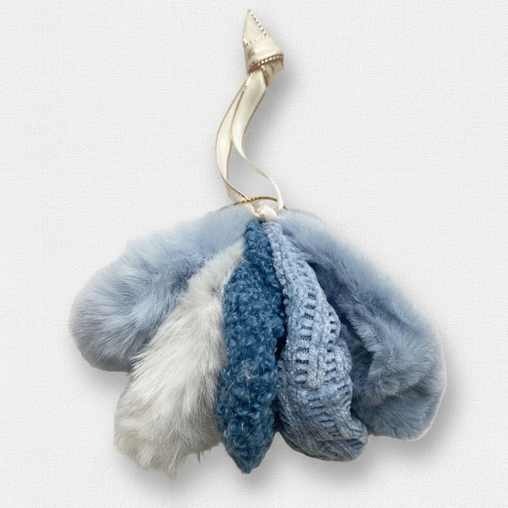 Blue and white scrunchies on a textured surface