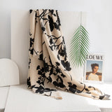 taupe fringe scarf with black floral printed design