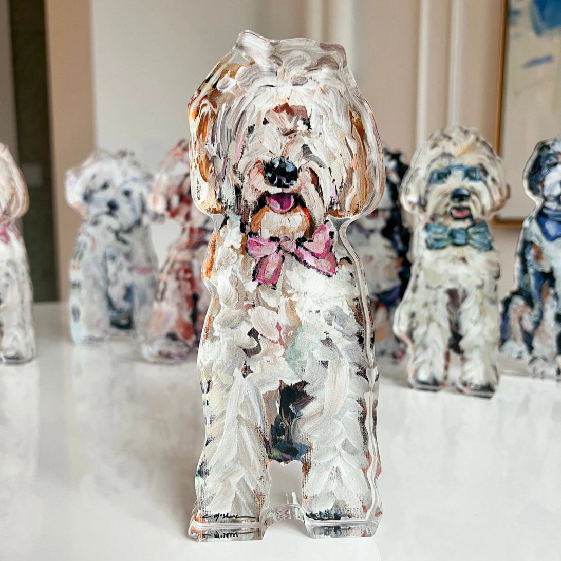 Collection of dog figurines with floral patterns on a white surface