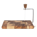 Wooden cutting board with a cheese slicer on a white background